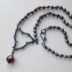 Oxidised silver knotted pearl necklace