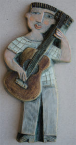 Ceramic Relief Guitar Player