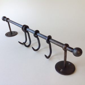 Four Hooks on Steel Rail