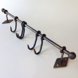 Five Hooks on Steel Rail