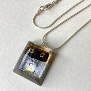 ‘Silver & Gold Engraved Pendant’