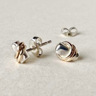 ‘Tiny Silver Studs With Gold Bands’