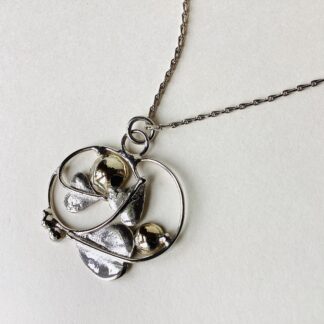 ‘Silver Pendant with 2 Gold Domes’