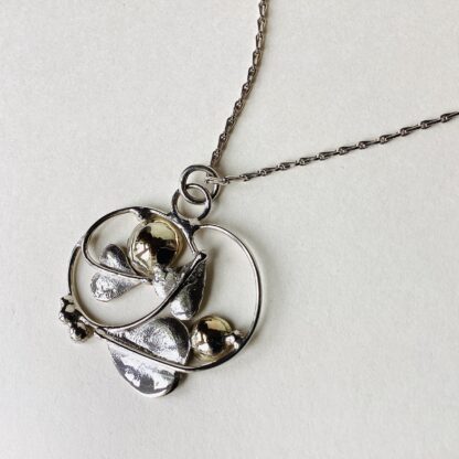 ‘Silver Pendant with 2 Gold Domes’