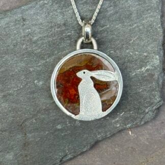 'Sitting Hare over Seam Agate'