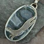 'Silver Otter over Moss Agate'
