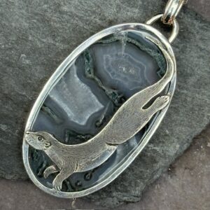 'Silver Otter over Moss Agate'