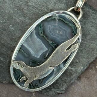 'Silver Otter over Moss Agate'